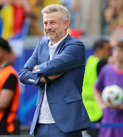 FRANKFURT AM MAIN, GERMANY - JUNE 26: head coach Edward Iordanescu of Romania smiles during the UEFA EURO 2024 group stage match between Slovakia and Romania at Frankfurt Arena on June 26, 2024 in Frankfurt am Main, Germany. (Photo by Marco Steinbrenner/DeFodi Images via Getty Images)