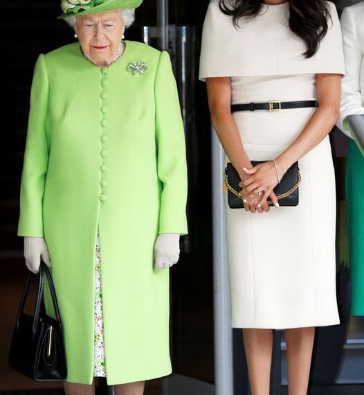 CHESTER, ENGLAND - JUNE 14:  Queen Elizabeth II and Meghan, Duchess of Sussex take a moment of silence for the victums of last year's Grenfell Tower fire as they arrive for their visit to the Storyhouse on June 14, 2018 in Chester, England. Meghan Markle married Prince Harry last month to become The Duchess of Sussex and this is her first engagement with the Queen. During the visit the pair will open a road bridge in Widnes and visit The Storyhouse and Town Hall in Chester.  (Photo by Phil Noble - WPA Pool/