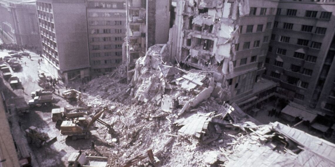 Romanian troops search for victims amidst the rubble and bulldozers eat into the debris, after a massive earthquake had destroyed buildings and caused a huge toll of deaths in the Romanian capital of Bucharest in March 1977. Total property damage has been estimated at around 500-million dollars with at least 7,000 families rendered homeless. No figures for deaths have yet been released. (AP Photo/Michel Lipchitz)